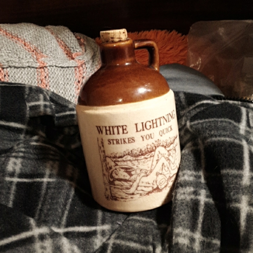 Decorative ceremic jug with cork